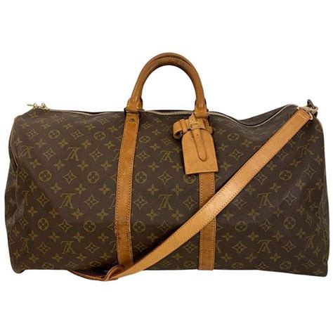 canvas lv|keepall 55 with shoulder strap.